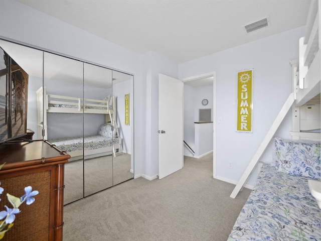 bedroom with carpet floors and a closet