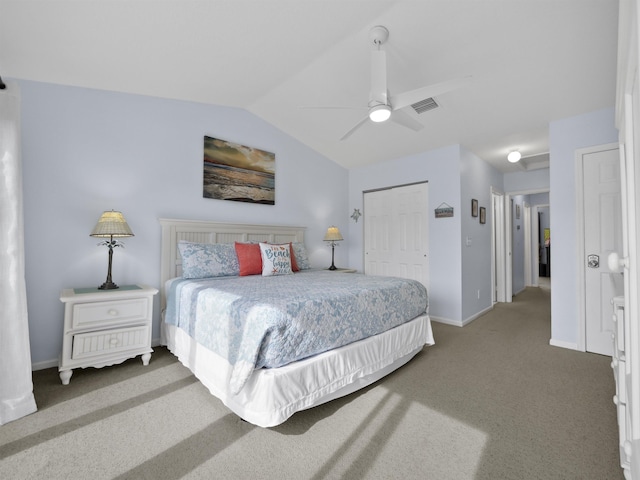 bedroom with carpet flooring, a closet, ceiling fan, and lofted ceiling