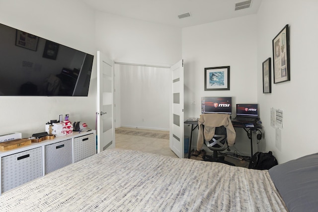 bedroom featuring light tile patterned floors