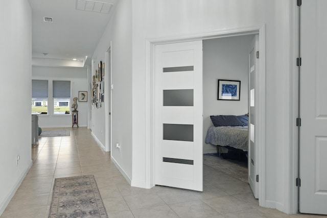 hallway with light tile patterned floors