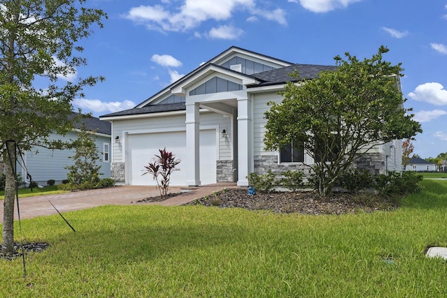 craftsman-style home with a garage and a front lawn