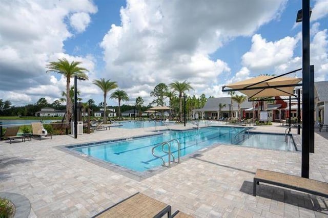 view of swimming pool with a patio