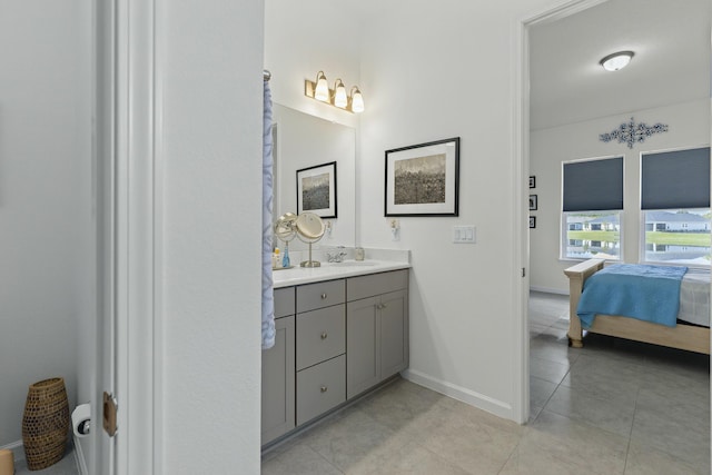 bathroom with tile patterned flooring and vanity