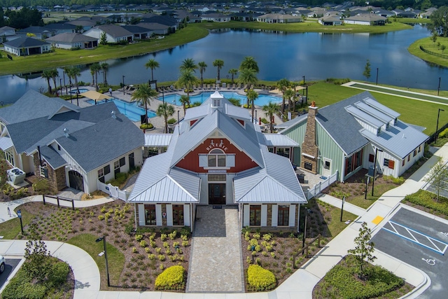 birds eye view of property featuring a water view