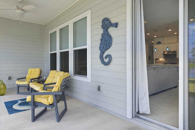 view of patio / terrace featuring ceiling fan and covered porch