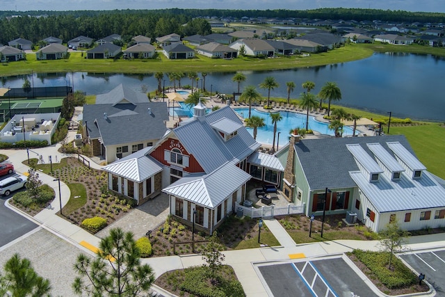 birds eye view of property featuring a water view