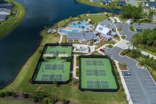 birds eye view of property with a water view