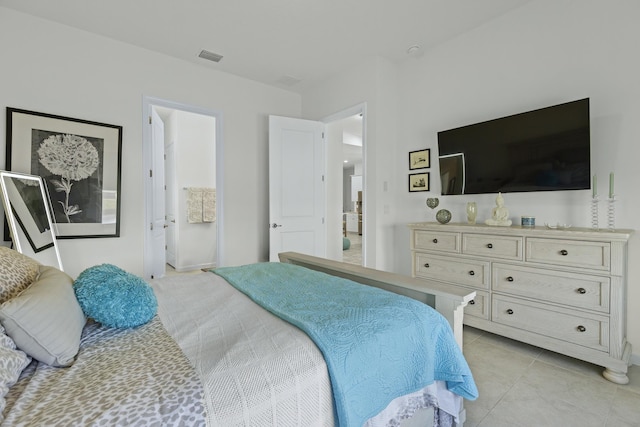 bedroom with light tile patterned floors