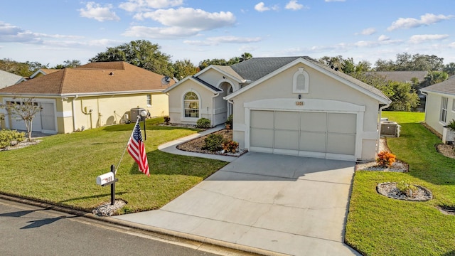 single story home with a garage, stucco siding, concrete driveway, and a front yard