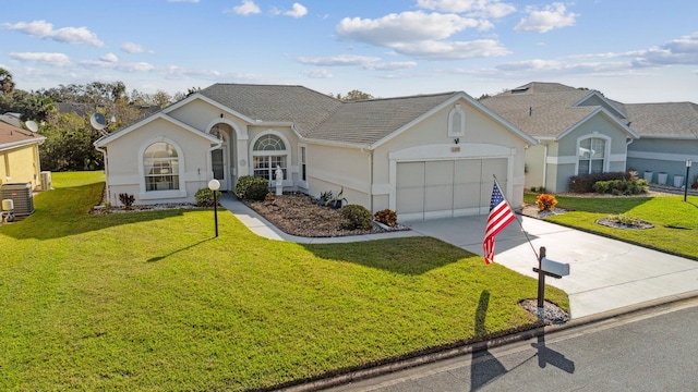 ranch-style house with a front yard, central AC unit, stucco siding, concrete driveway, and a garage