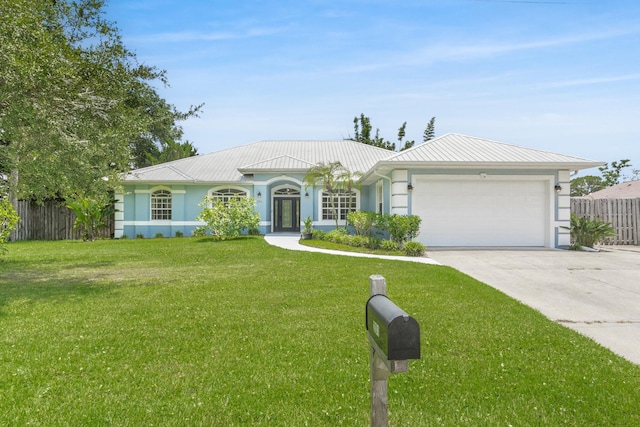 single story home with a garage and a front yard