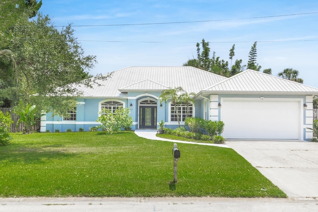 ranch-style home with a garage and a front yard