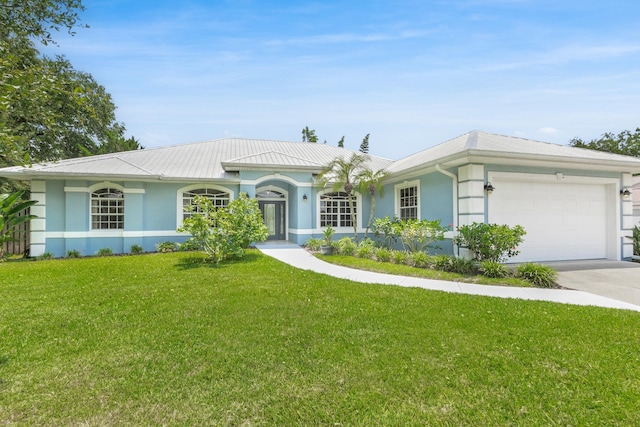 ranch-style home with a garage and a front yard