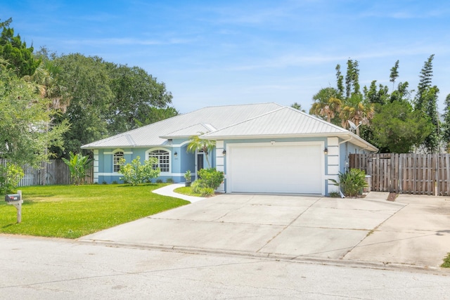 ranch-style home with a garage and a front yard