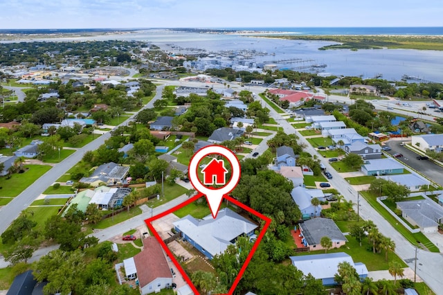 birds eye view of property featuring a water view