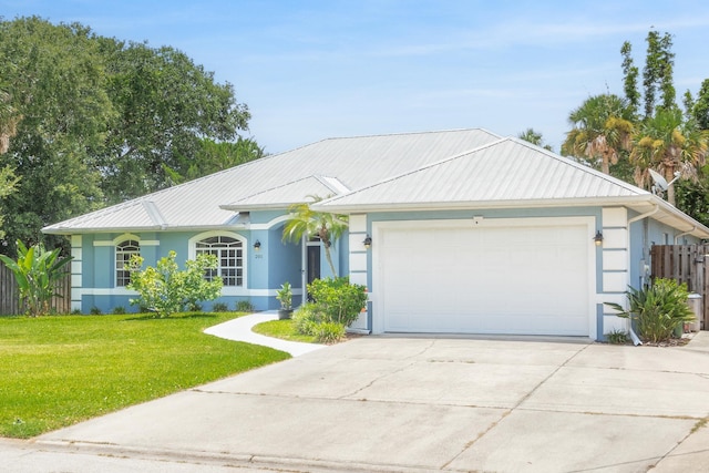 ranch-style home with a garage and a front yard