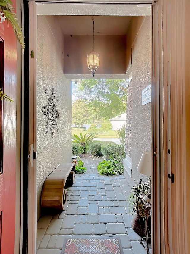 entryway with a chandelier