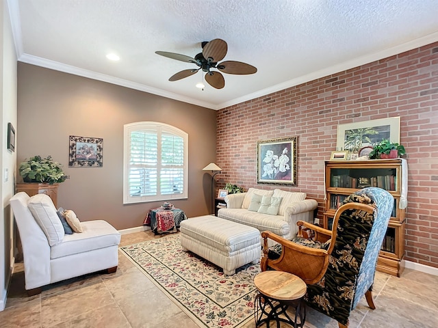 living room with ceiling fan, ornamental molding, a textured ceiling, light tile patterned flooring, and brick wall