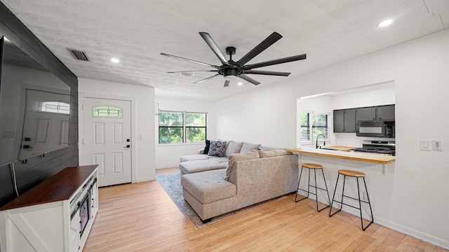 1403 S 15th St, Palatka, FL 32177 - living room featuring light wood-style flooring, a ceiling fan, visible vents, recessed lighting, and baseboards