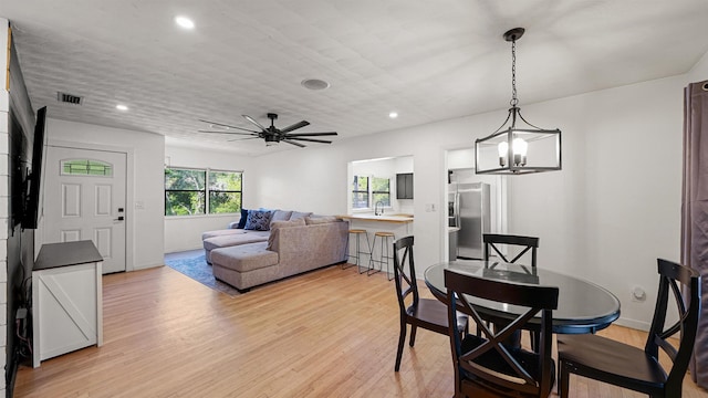 1403 S 15th St, Palatka, FL 32177 - dining room with visible vents, light wood-type flooring, recessed lighting, and ceiling fan with notable chandelier