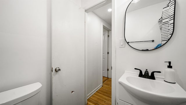 1403 S 15th St, Palatka, FL 32177 - bathroom with toilet, recessed lighting, vanity, and wood finished floors