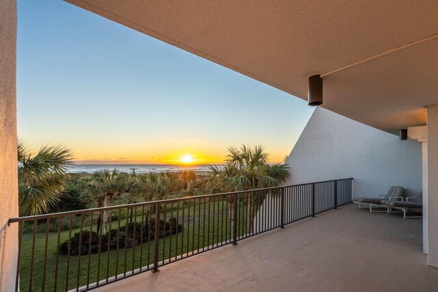 balcony at dusk with a water view