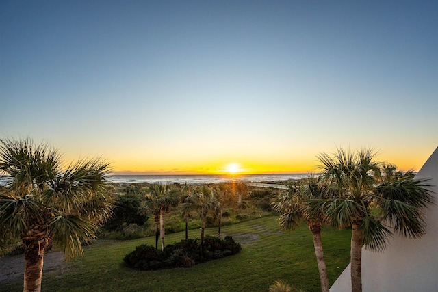 yard at dusk with a water view