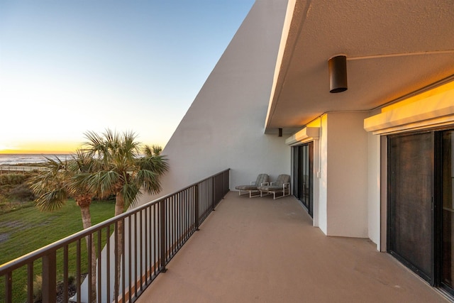 view of balcony at dusk