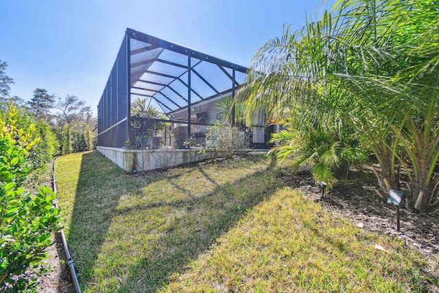 view of yard with glass enclosure