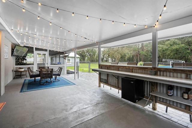 view of patio with outdoor dining area and outdoor dry bar