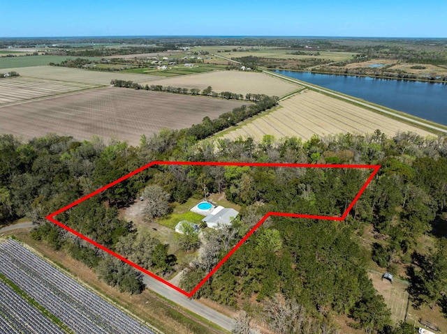 aerial view with a water view and a rural view