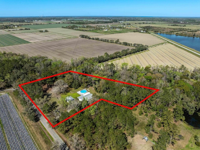 aerial view with a rural view and a water view