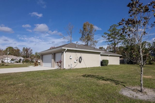 view of property exterior with a yard and a garage