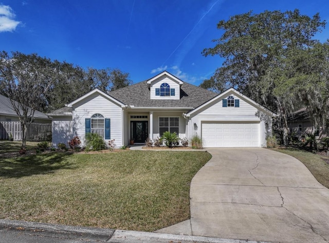 view of front of property featuring a front lawn and a garage