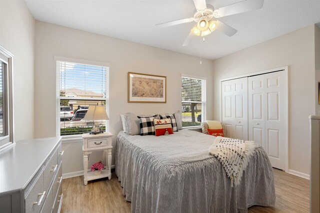 2251 Golden Lake Loop, Saint Augustine, FL 32084 - bedroom with light wood-style flooring, a closet, and a ceiling fan