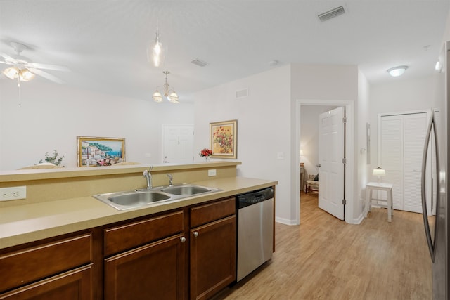 2251 Golden Lake Loop, Saint Augustine, FL 32084 - kitchen with stainless steel appliances, light wood-style flooring, light countertops, and ceiling fan