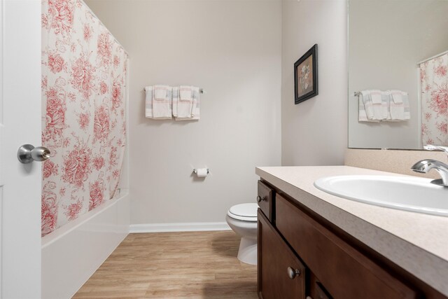 2251 Golden Lake Loop, Saint Augustine, FL 32084 - bathroom with vanity, wood finished floors, and shower / tub combo with curtain
