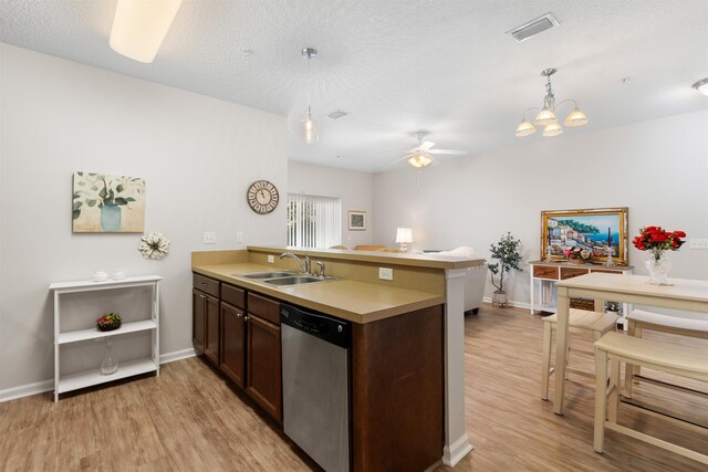2251 Golden Lake Loop, Saint Augustine, FL 32084 - kitchen with stainless steel dishwasher, a peninsula, light wood finished floors, a ceiling fan, and light countertops