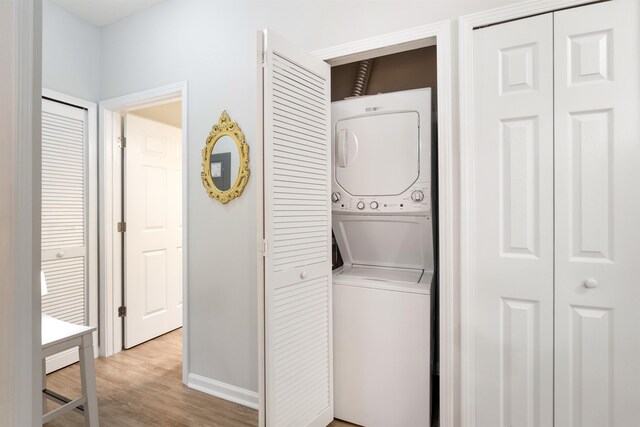 2251 Golden Lake Loop, Saint Augustine, FL 32084 - washroom with estacked washer and dryer and light wood-style flooring