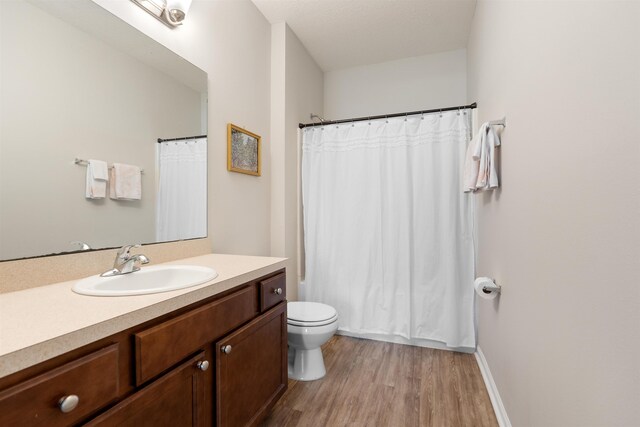 2251 Golden Lake Loop, Saint Augustine, FL 32084 - full bathroom with vanity, wood finished floors, and shower / bath combination with curtain