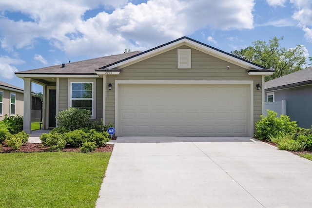 2730 Oak Stream Dr, Green Cove Springs, FL 32043 - single story home with concrete driveway, a garage, and a front yard