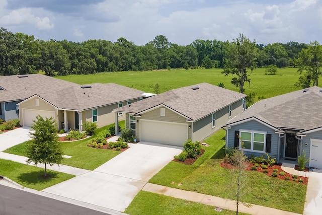2730 Oak Stream Dr, Green Cove Springs, FL 32043 - ranch-style home with driveway, a garage, a front lawn, and roof with shingles