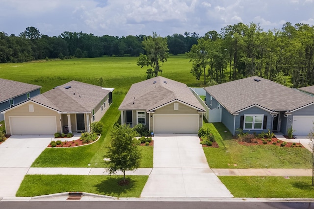 2730 Oak Stream Dr, Green Cove Springs, FL 32043 - view of front of home with concrete driveway, an attached garage, and a front yard