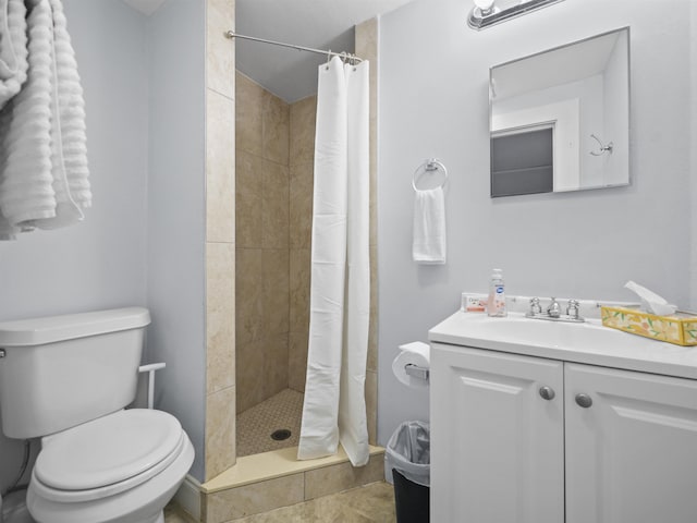 bathroom with vanity, a shower with curtain, and toilet