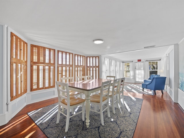 dining room with hardwood / wood-style flooring