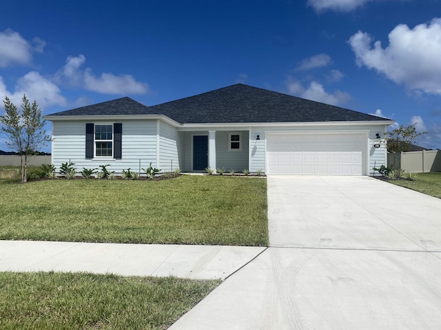 single story home featuring a front lawn and a garage