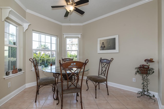 dining area with light tile patterned flooring, ceiling fan, and crown molding