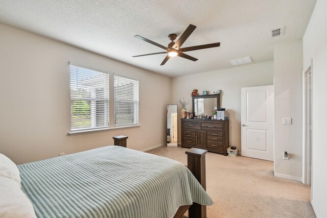 182 Myrtle Oak Ct, Saint Augustine, FL 32092 - bedroom with light carpet, baseboards, ceiling fan, and a textured ceiling