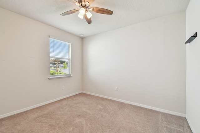 182 Myrtle Oak Ct, Saint Augustine, FL 32092 - spare room with light carpet, baseboards, ceiling fan, and a textured ceiling