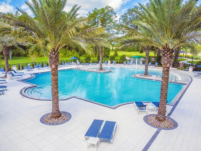 182 Myrtle Oak Ct, Saint Augustine, FL 32092 - community pool featuring a water view and a patio area